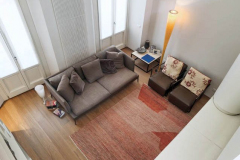 PROGETTO BONFIGLIO E GABRIELLI

view from above of a modern living room with leather sofa and a armchair on the carpet