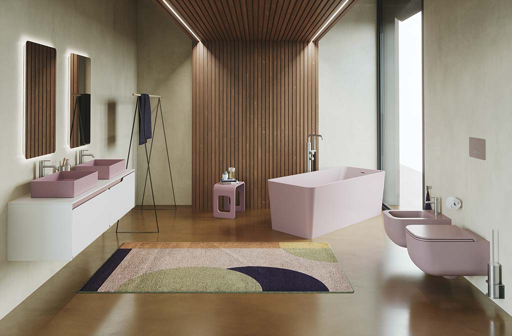 Interni di un bagno con sanitari, lavabi e vasca da bagno di colore rosa modello Revolution di SDR