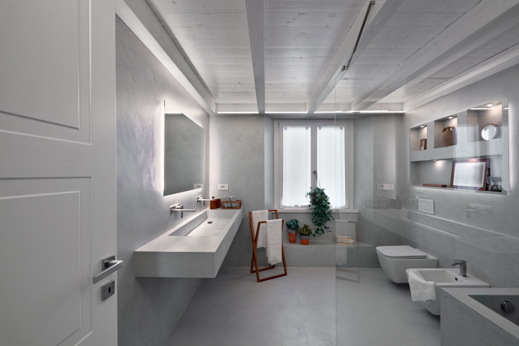 modern bathroom entirely covered in grey resin